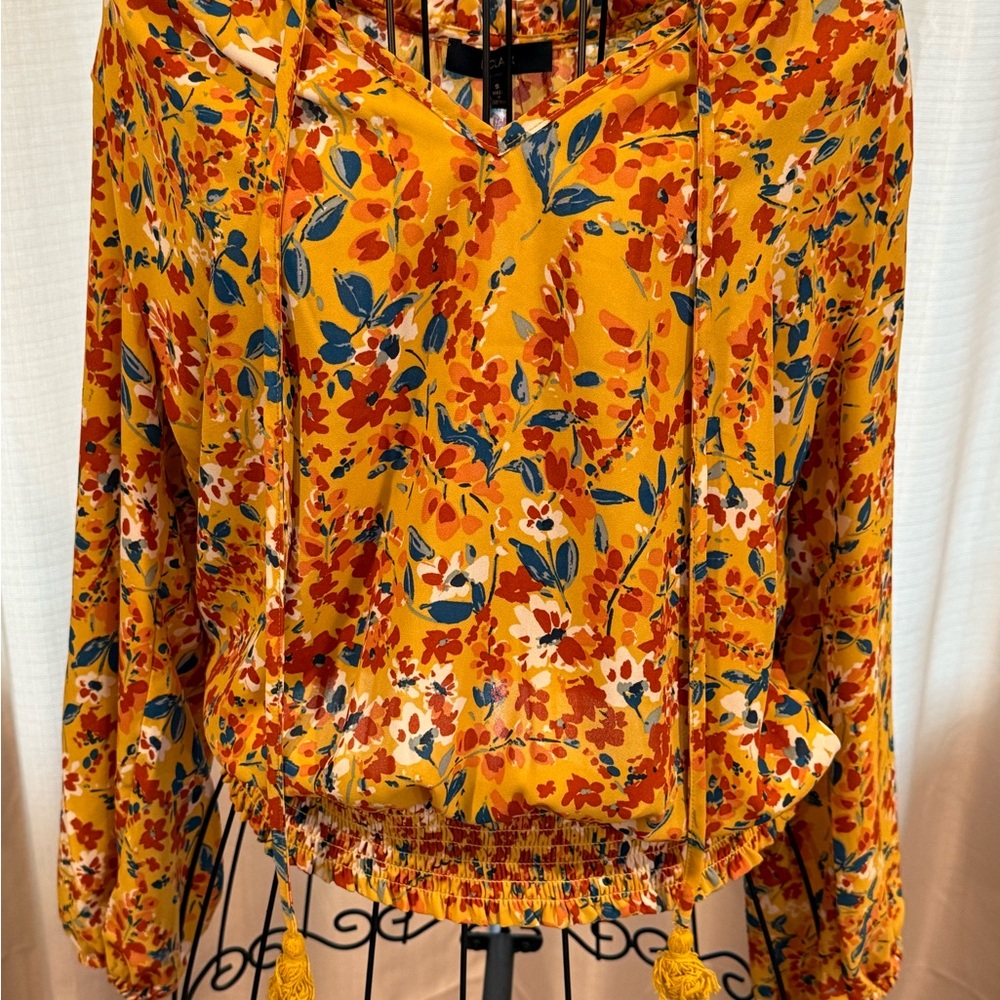 Vibrant Eclair Brand Fall Floral Blouse with Tassel and Cinch Details.